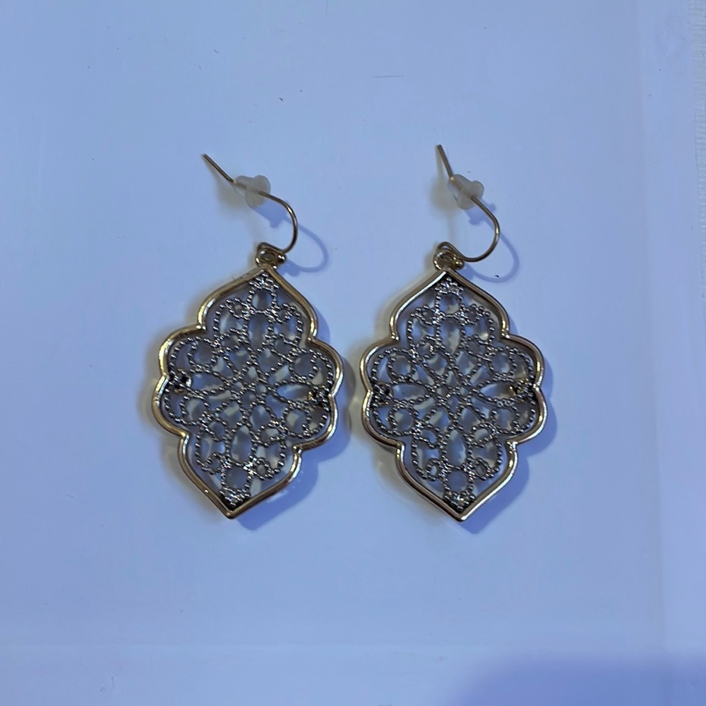 Gold and silver dangling earrings